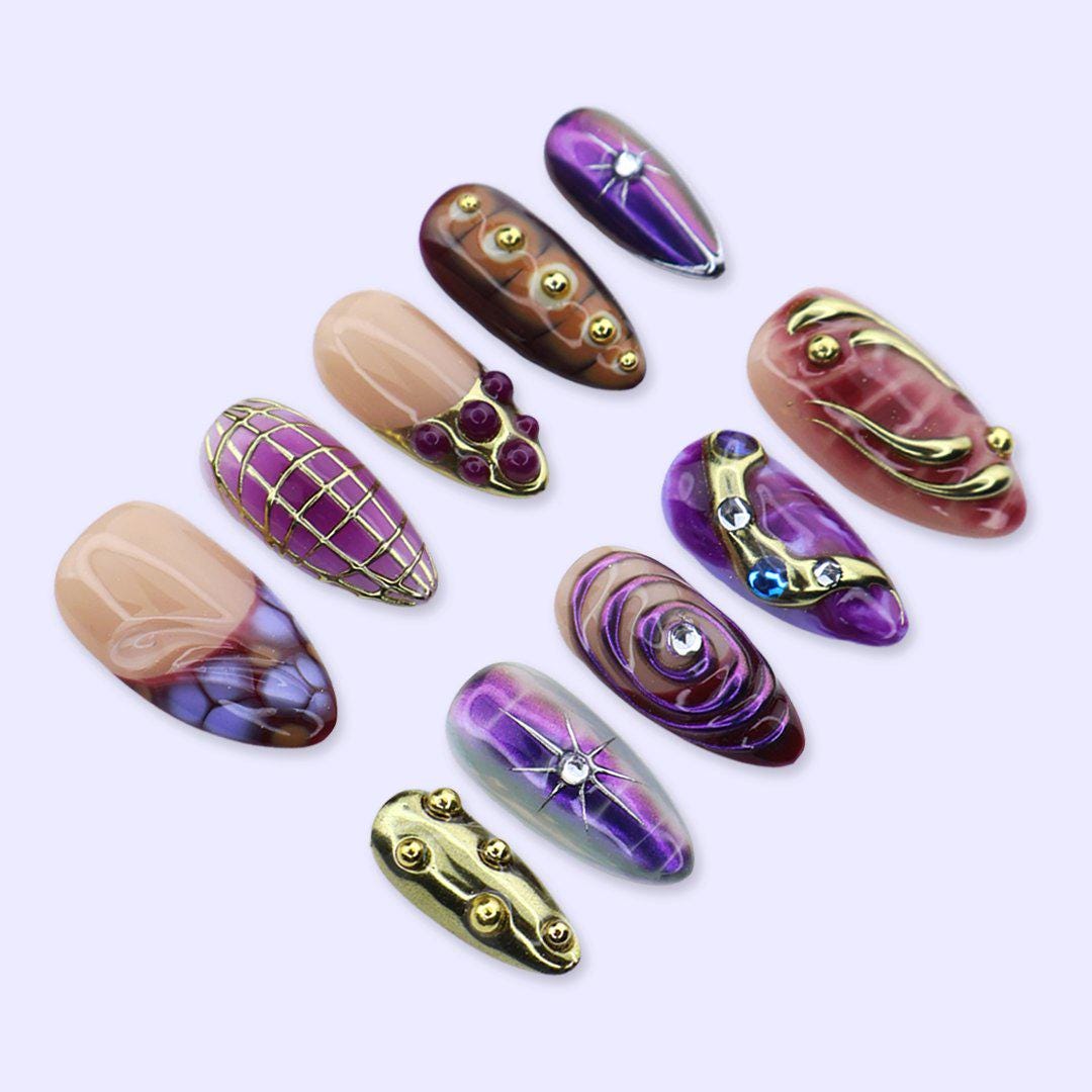 Y2K Purple and Burgundy Chrome Nails with Gold Grids, Swirls and Gem Accents