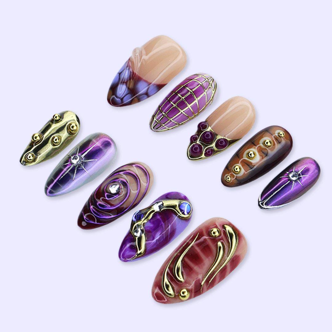 Y2K Purple and Burgundy Chrome Nails with Gold Grids, Swirls and Gem Accents