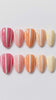 Pink, Orange, and Yellow Gradient Nails with White Wavy Stripes
