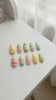 Pastel Fruit and Star Nails with Colorful Stripes and French Tips