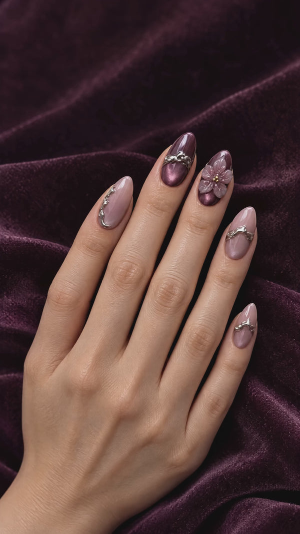 Plum magnetic cat eye press-on nails on velvet