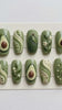 3D Avocado Press-On Nails with Green Swirls, Brown Pits, and Floral Sprigs