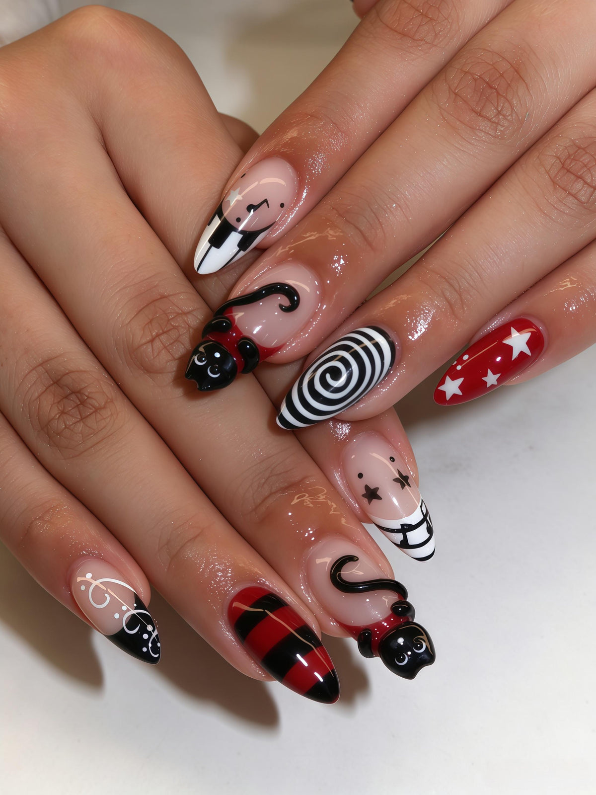 Red and Black Cat Charm Nails With Spirals, Stars, and French Tips
