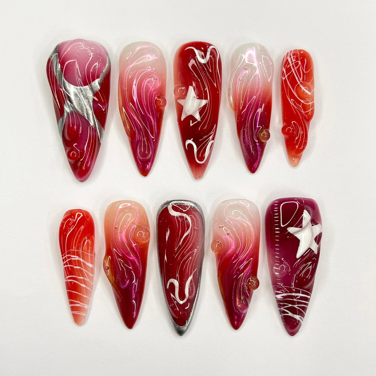 Red and Burgundy Swirl Press On Nails With White Star Charms and Silver Accents