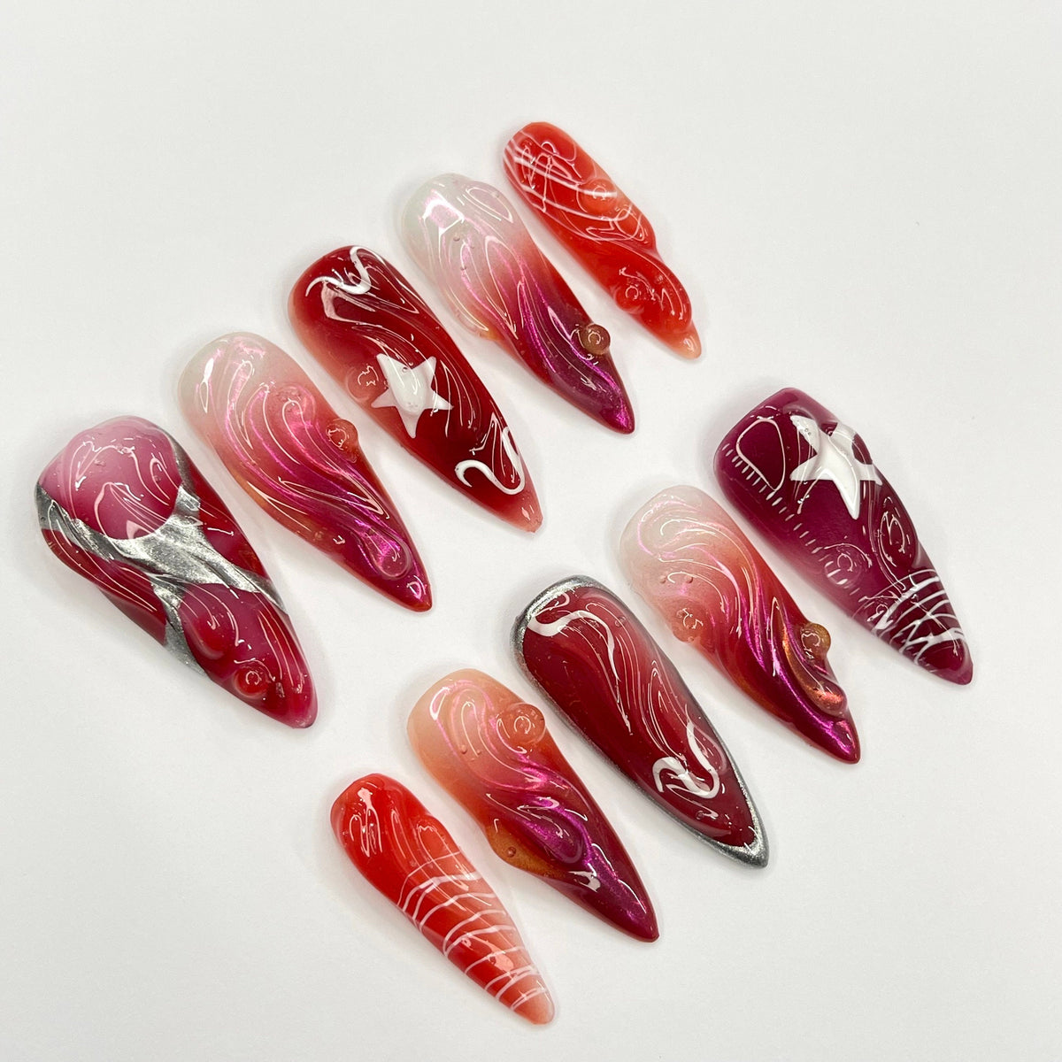Red and Burgundy Swirl Press On Nails With White Star Charms and Silver Accents