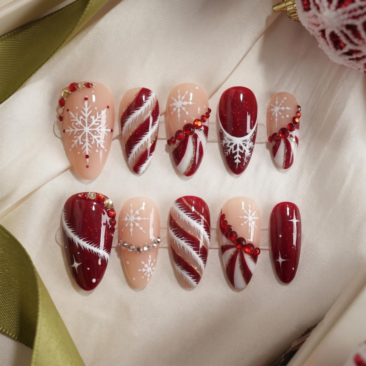Red and Nude Christmas Nails with Snowflakes, Candy Cane Stripes, Glitter and Rhinestones