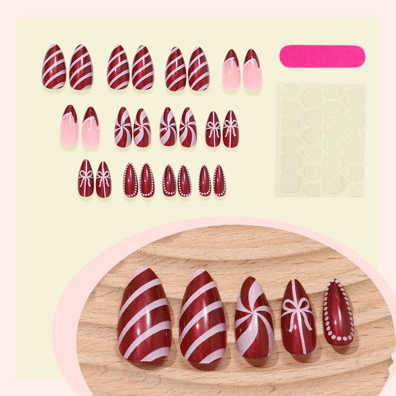 Red and Pink Christmas Candy Swirl Nails with Bows and Polka Dot Details