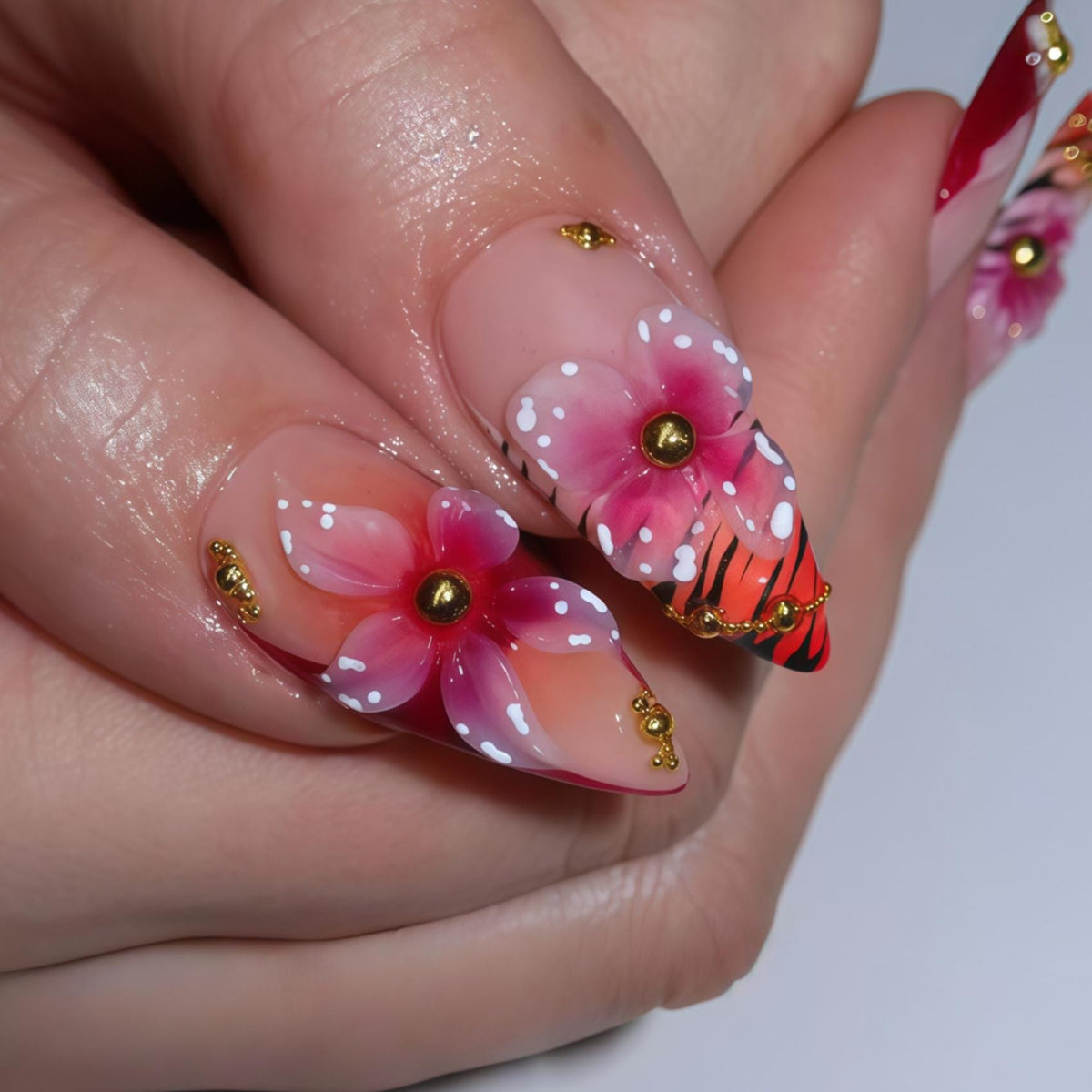 Red and Sheer Pink Floral Butterfly Nails with Gold Beads and Wing-Inspired Stripes