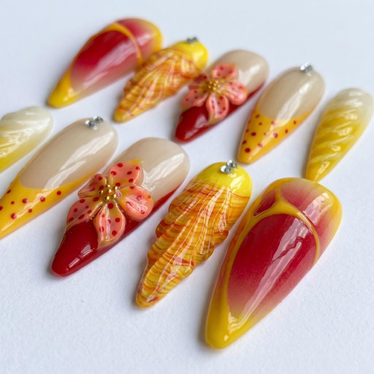 Red and Yellow Summer Tropical Flower Press-On Nails with Plaid, Marble, and Rhinestone Details