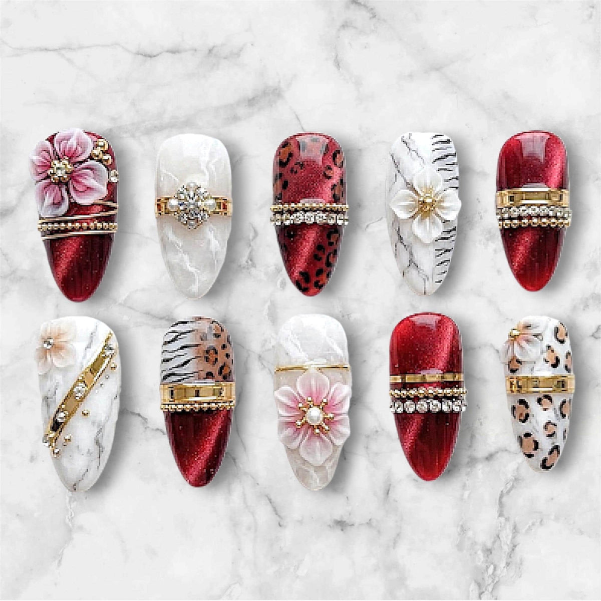 Red Cat-Eye Marble and Animal-Print Nails With 3D Flowers and Gold Details