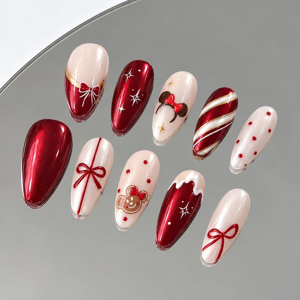 Red Metallic Christmas Nails With Bows, Candy Cane Stripes and Holiday Details