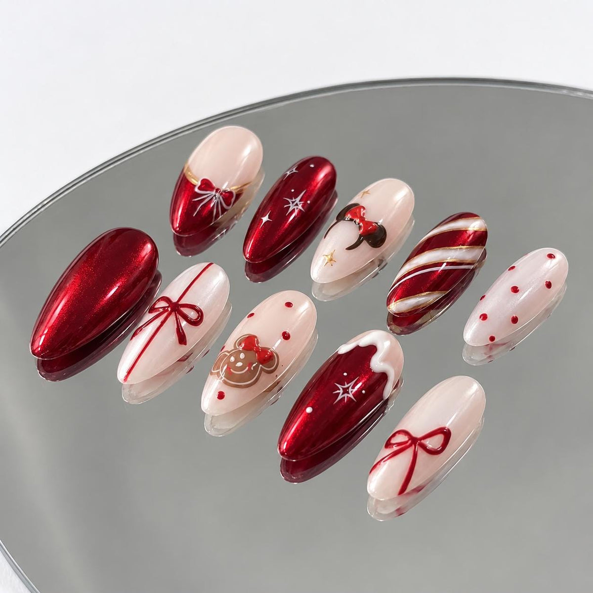 Red Metallic Christmas Nails With Bows, Candy Cane Stripes and Holiday Details