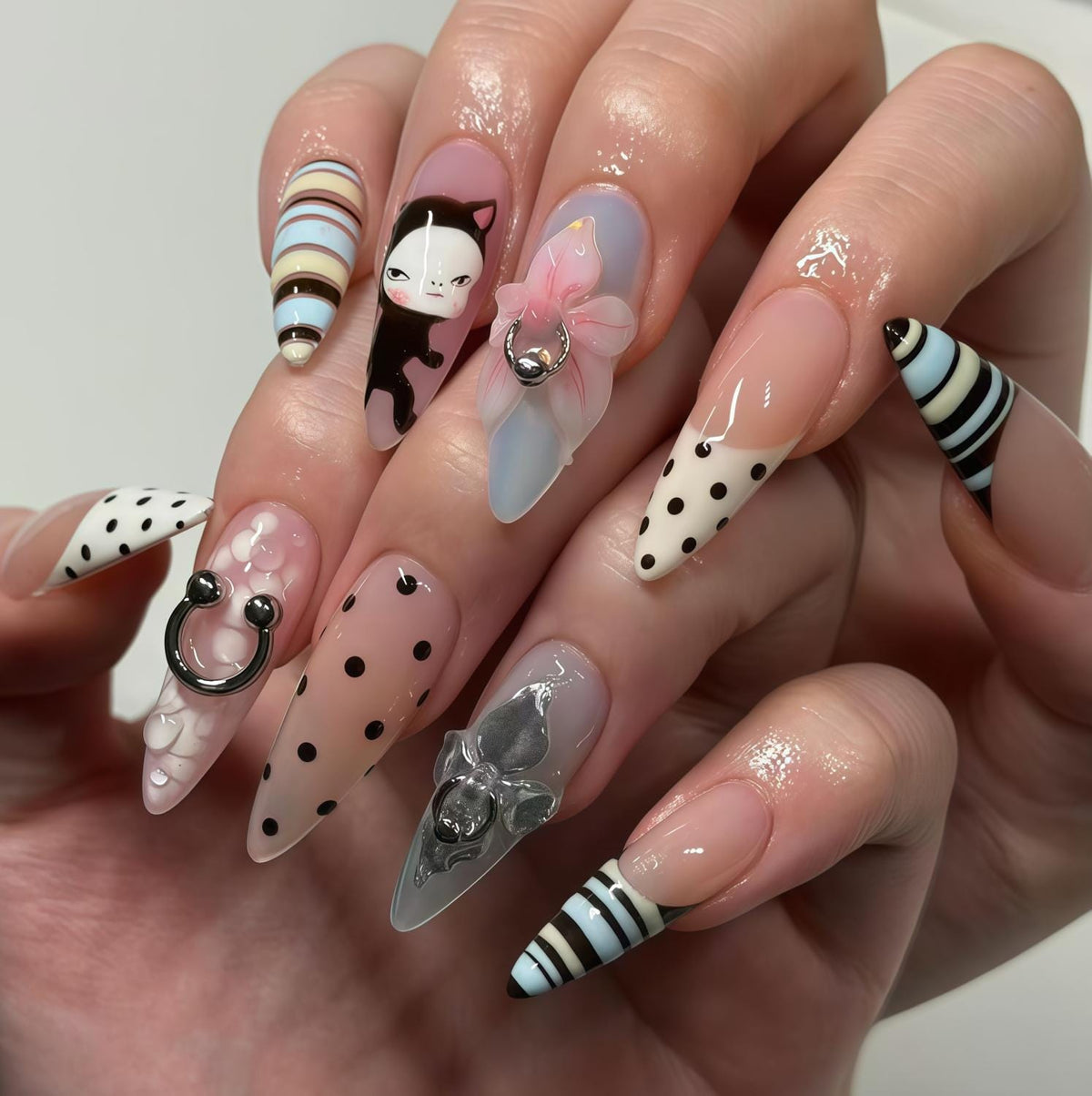 Retro Cat Nail Set With Polka Dots, Stripes, Pink Bow, and Metallic Charms