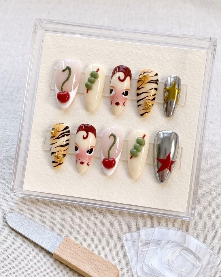 Retro Cherry and Tiger-Stripe Press On Nails with Chrome Stars and Illustrated Faces