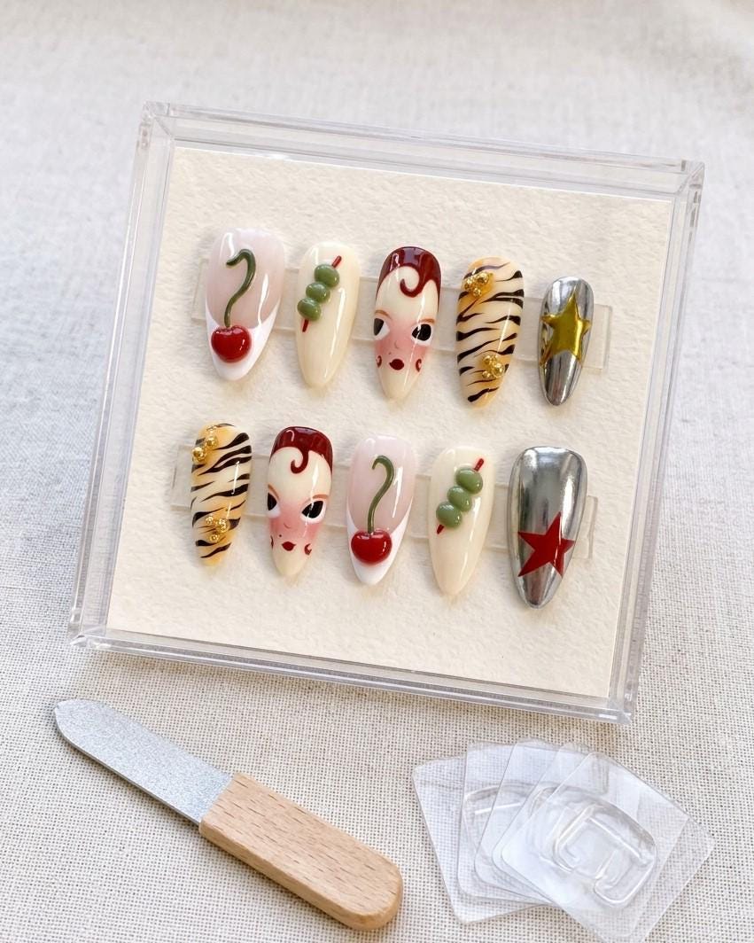 Retro Cherry and Tiger-Stripe Press On Nails with Chrome Stars and Illustrated Faces
