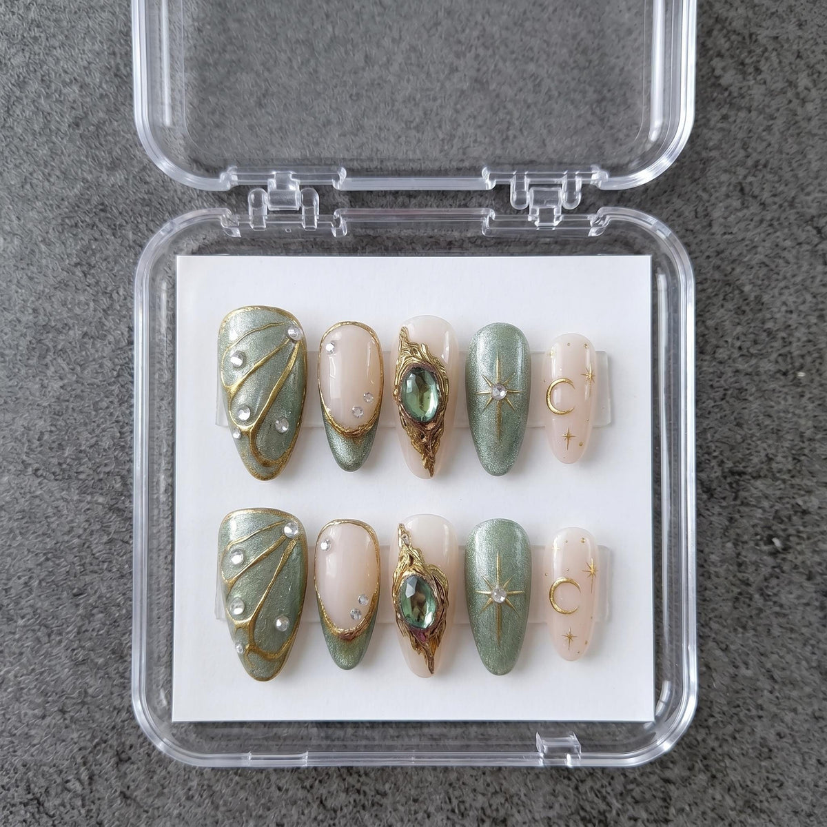 Sage Green and Blush Celestial Nails with Gold Moons and Gem Accents