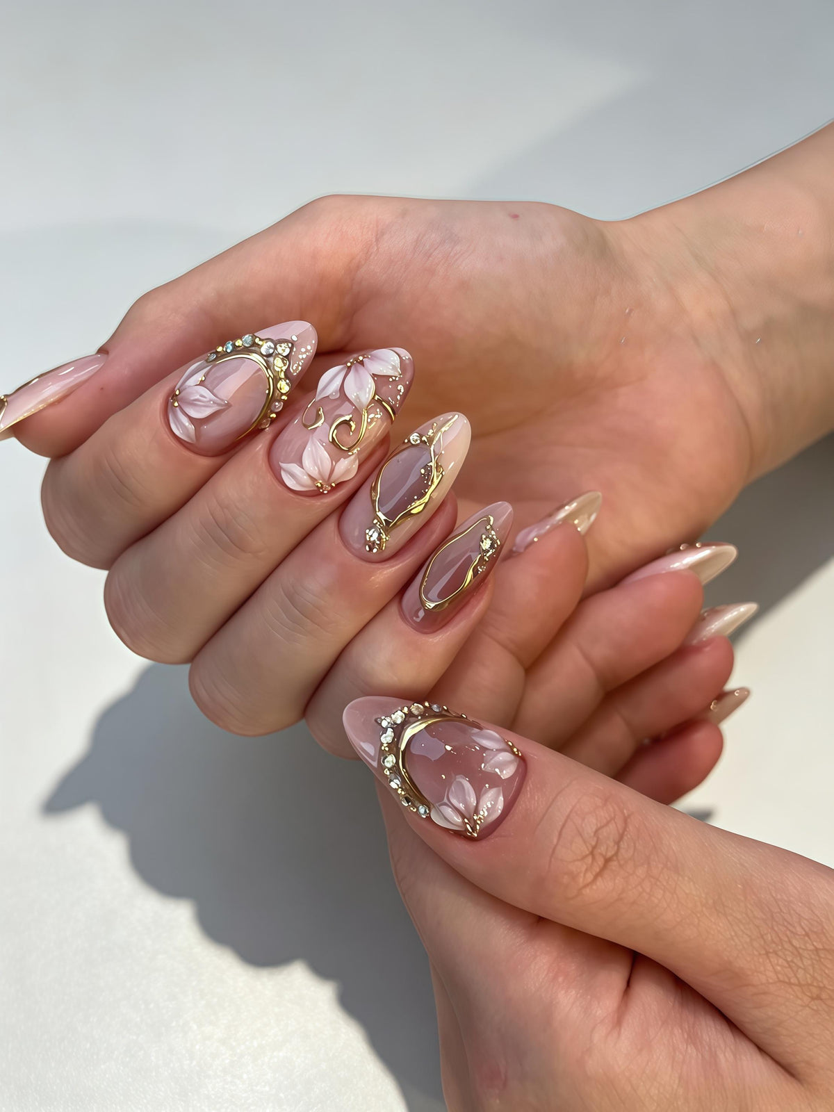 Sheer Blush Pink Floral Nails With Gold Frames and Rhinestones