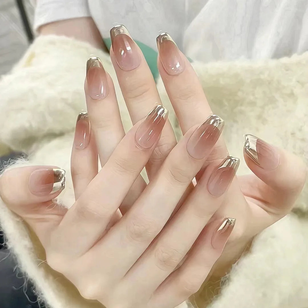 Sheer Nude Pink-Brown Nails with Reflective Gold French Tips
