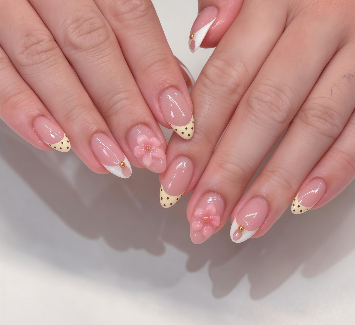 Sheer Nude Pink French Tip Nails With 3D Flowers, Polka Dots, and Gold Accents