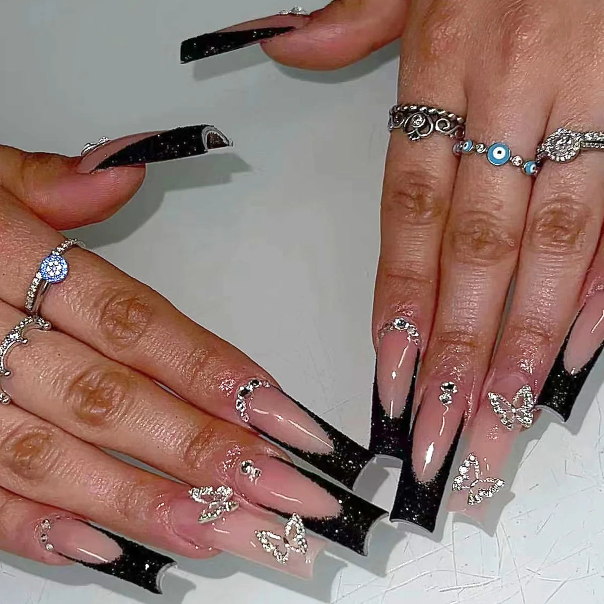 Sheer Nude Pink French Tip Press On Nails With Black Tips and Silver Charms