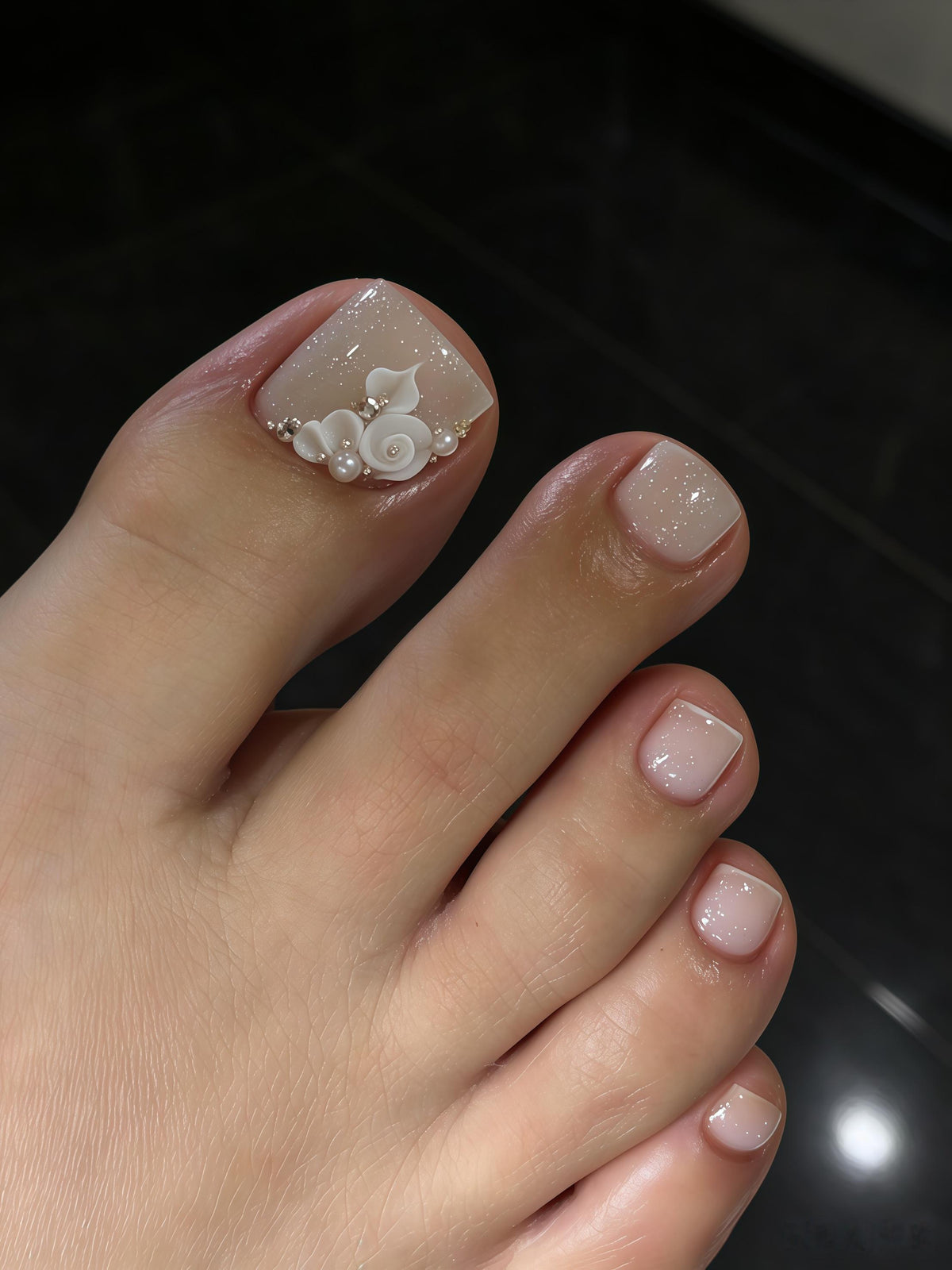 Sheer Nude Pink French Tip Toenails with 3D White Roses and Pearl Accents
