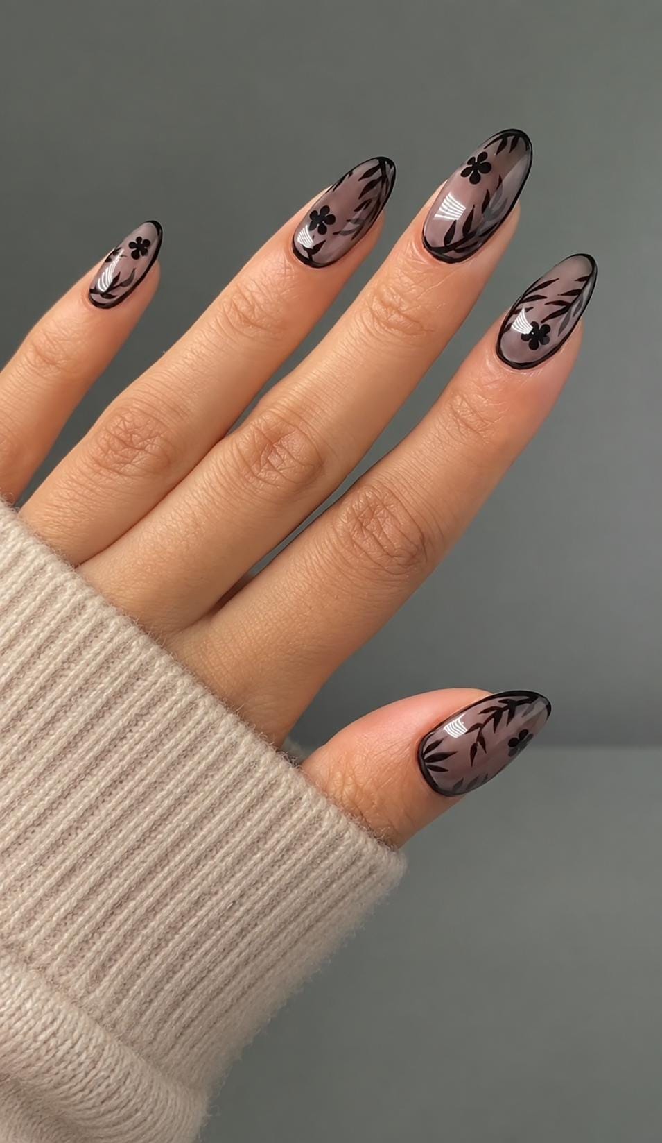 Sheer Nude Pink Nails With Black Floral and Leaf Designs