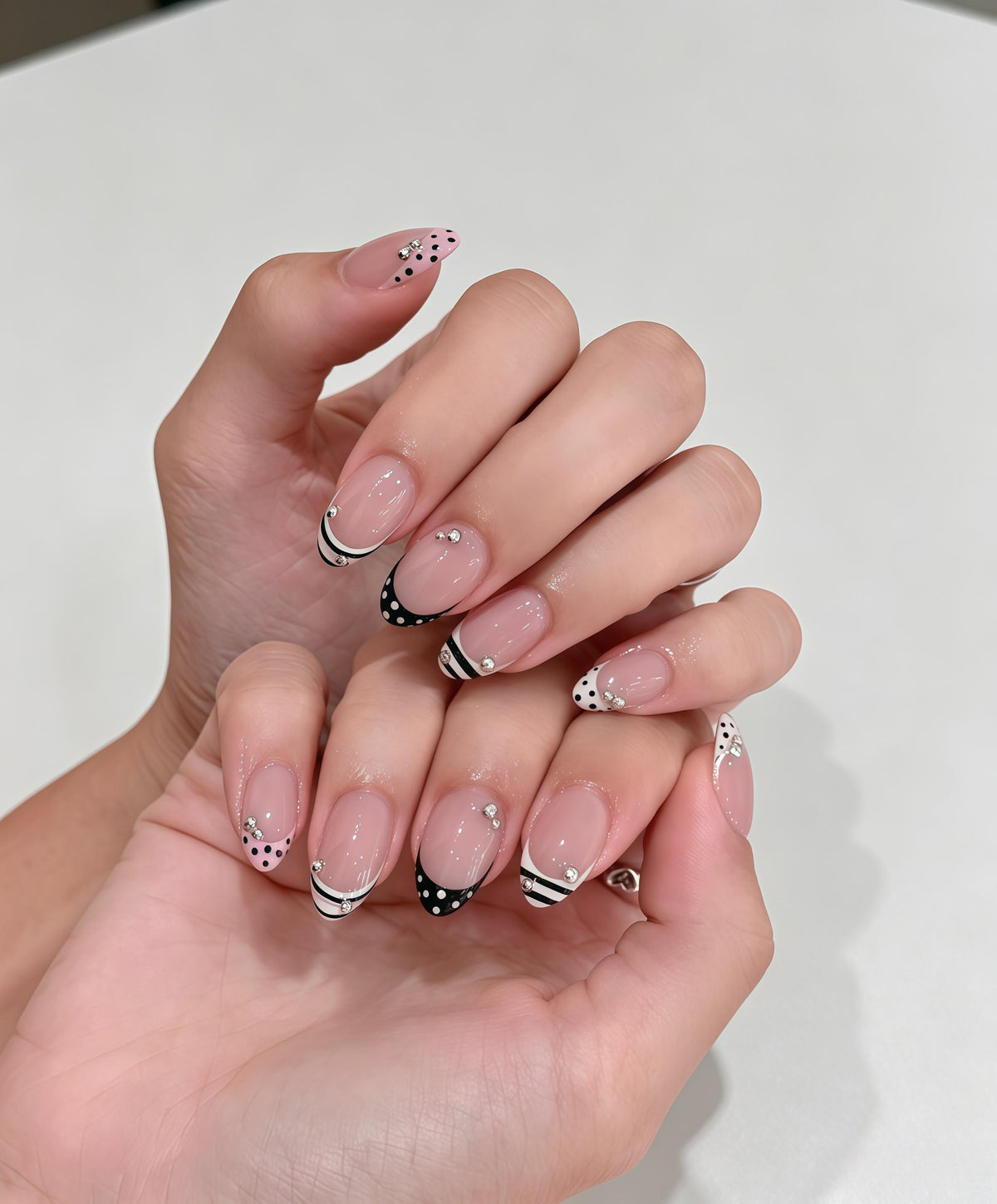 Sheer Nude Pink Polka Dot French Tip Nails With Rhinestones
