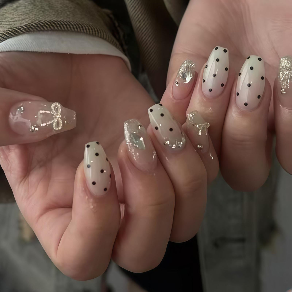 Sheer Nude Pink Polka Dot Nails with Silver Bows and Rhinestones