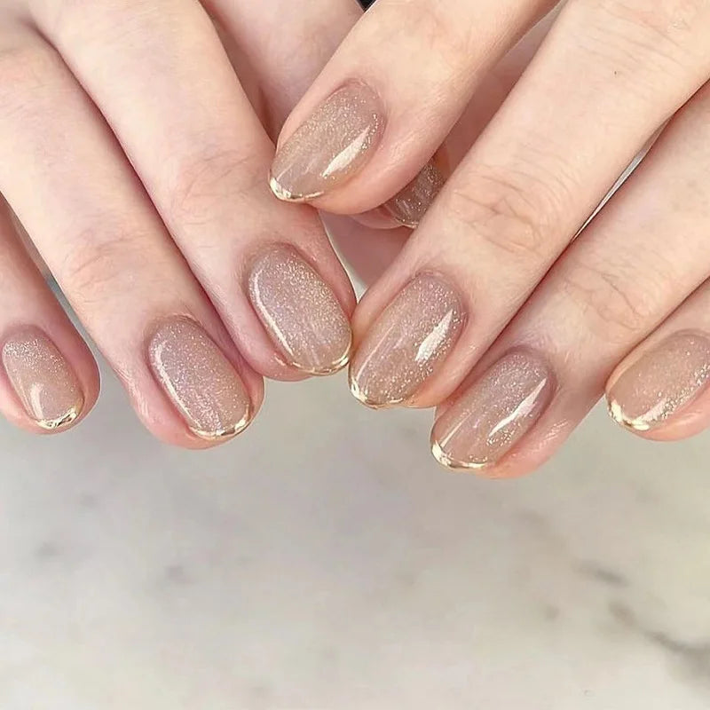 Sheer Nude-Taupe Shimmer Nails with Gold French Tips