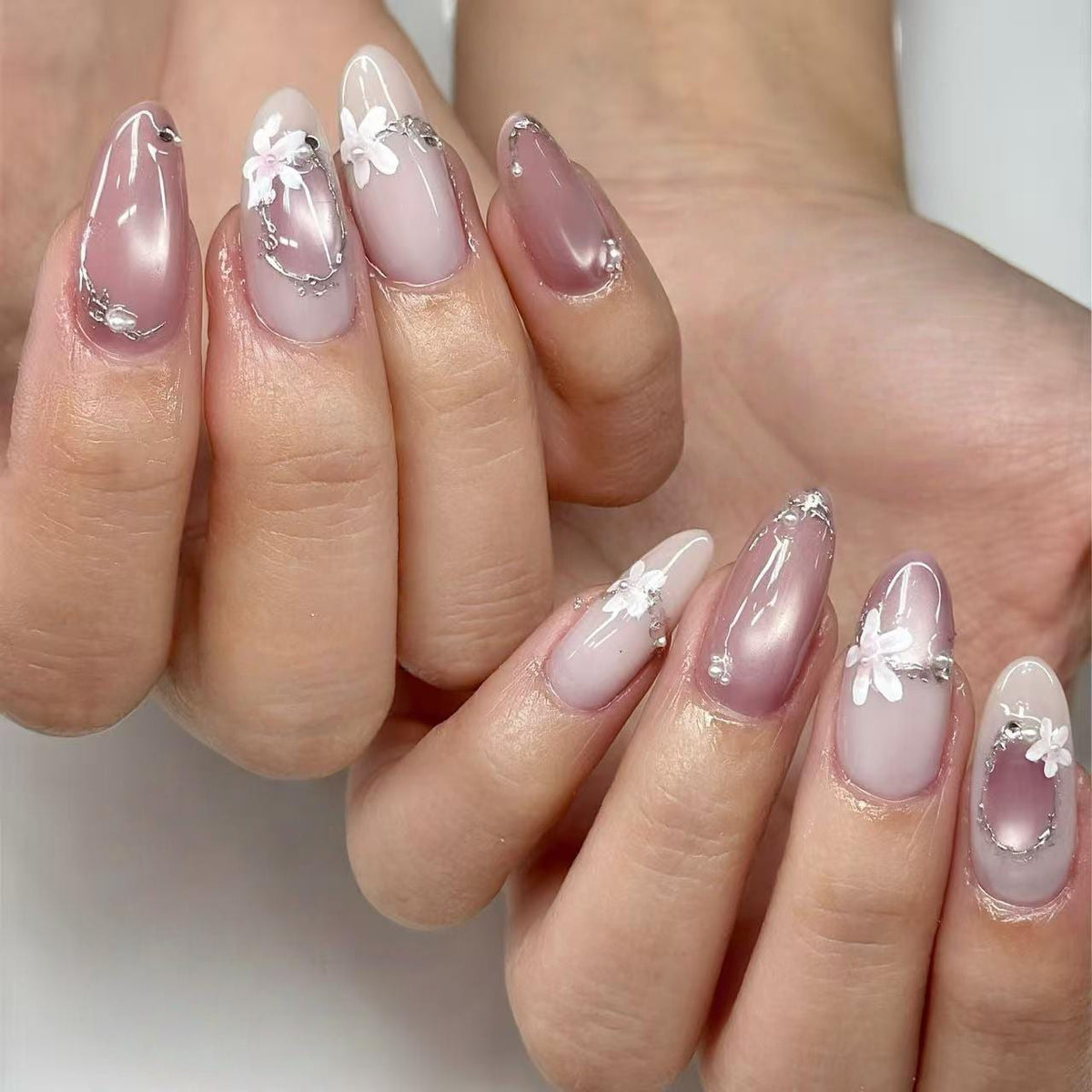 Sheer Pink Floral Press-On Nails with White Flowers and Silver Accents