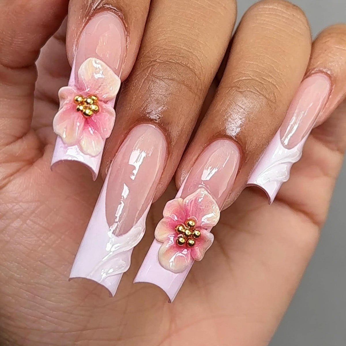 Sheer Pink French Tip Nails With 3D Flowers and Gold Bead Centers
