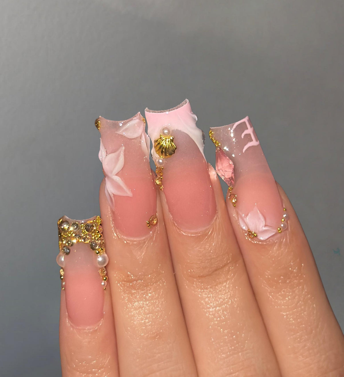 Sheer Pink French Tip Nails with 3D Flowers, Gold Beads and Charms