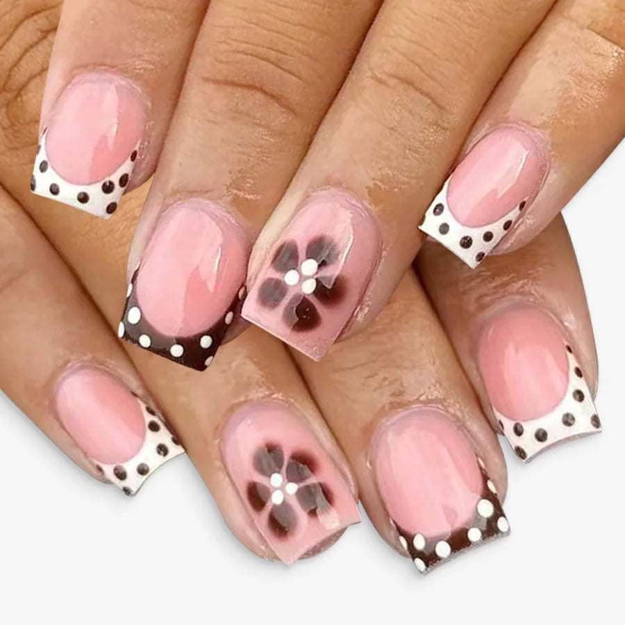 Sheer Pink French Tip Nails with Brown Polka Dots and Floral Accents