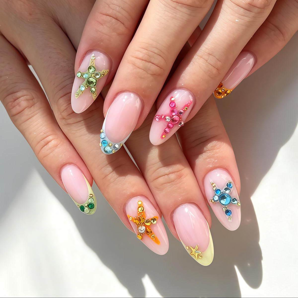 Sheer Pink French Tip Nails with Colorful 3D Starfish Rhinestones