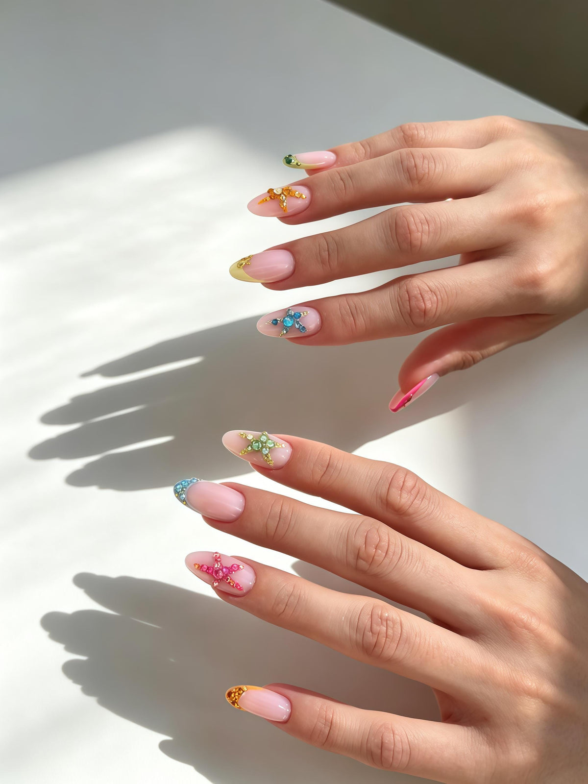 Sheer Pink French Tip Nails with Colorful 3D Starfish Rhinestones