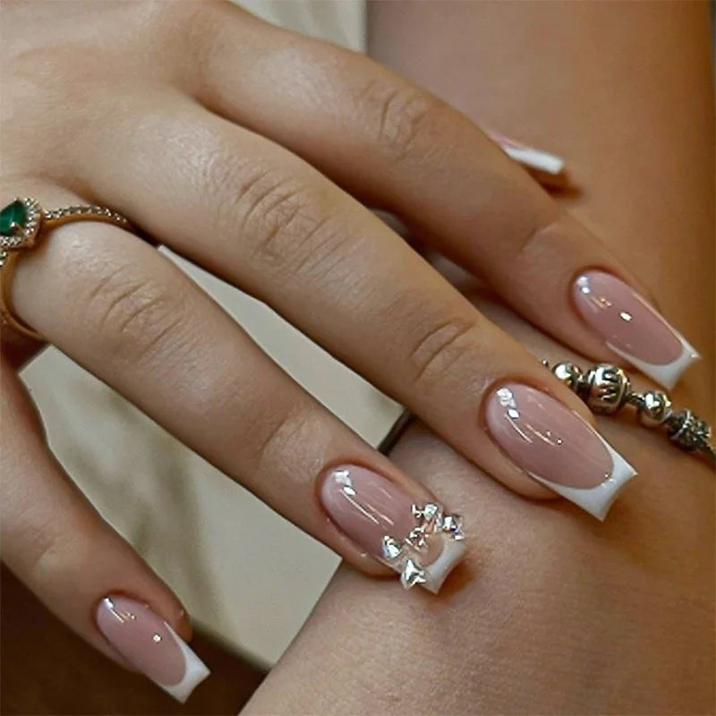 Sheer Pink French Tip Nails with Silver Bows, Stars and Rhinestones