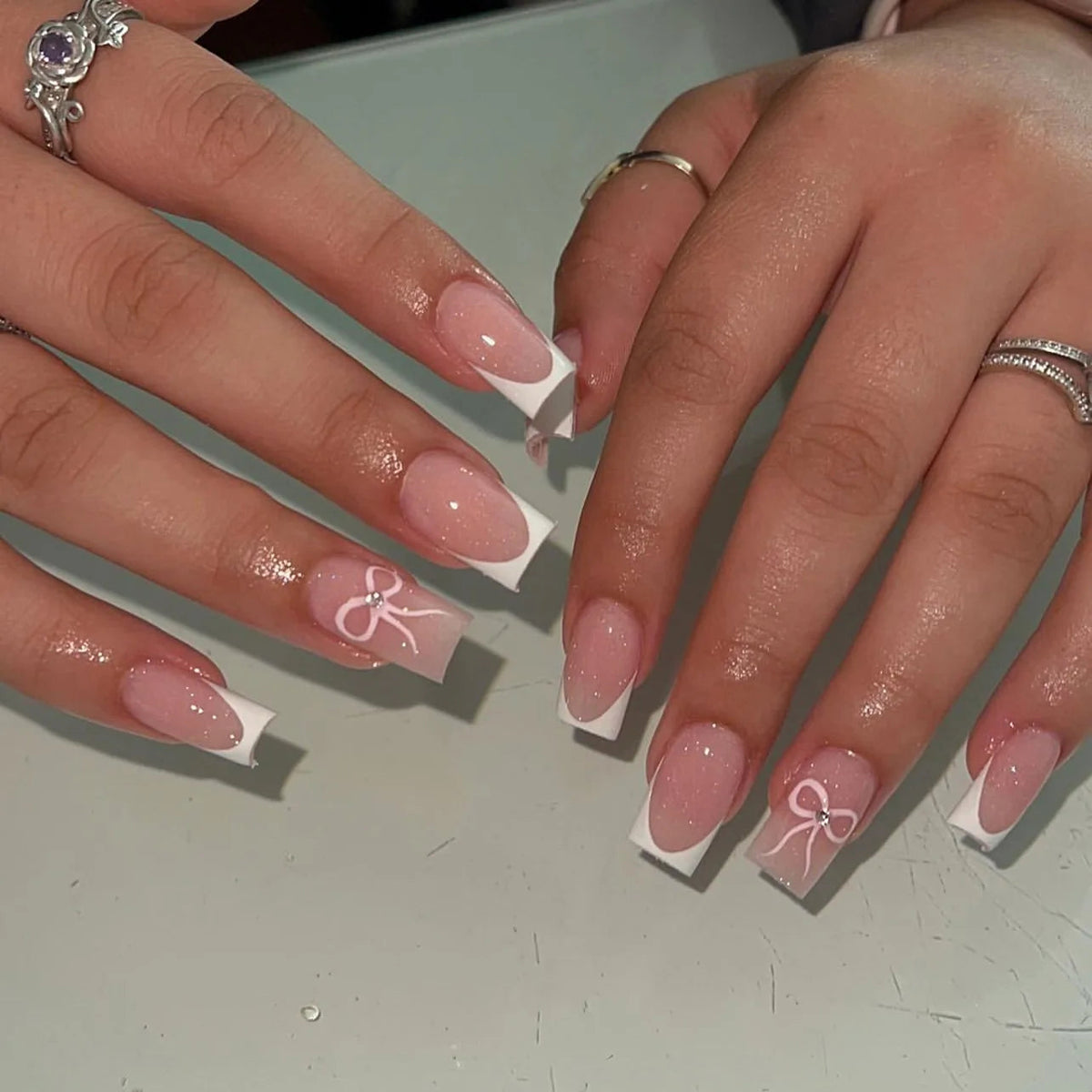 Sheer Pink French Tip Press On Nails with Delicate Bow Accents