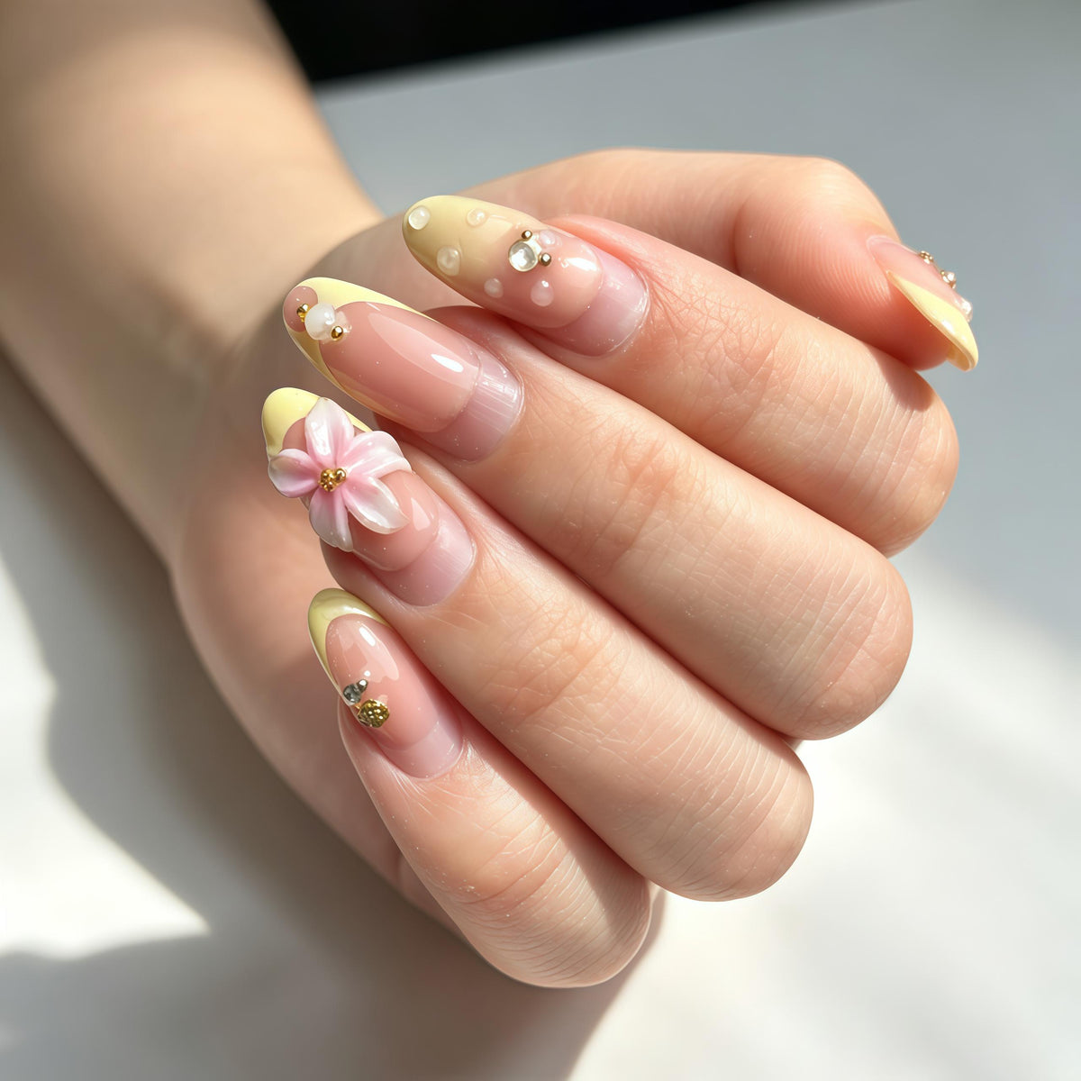 Sheer Pink Nude Nails with Yellow French Tips, 3D Flowers and Pearls for Spring & Summer
