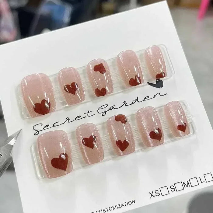 Sheer Pink Shimmer Press On Nails With Dark Red Hearts