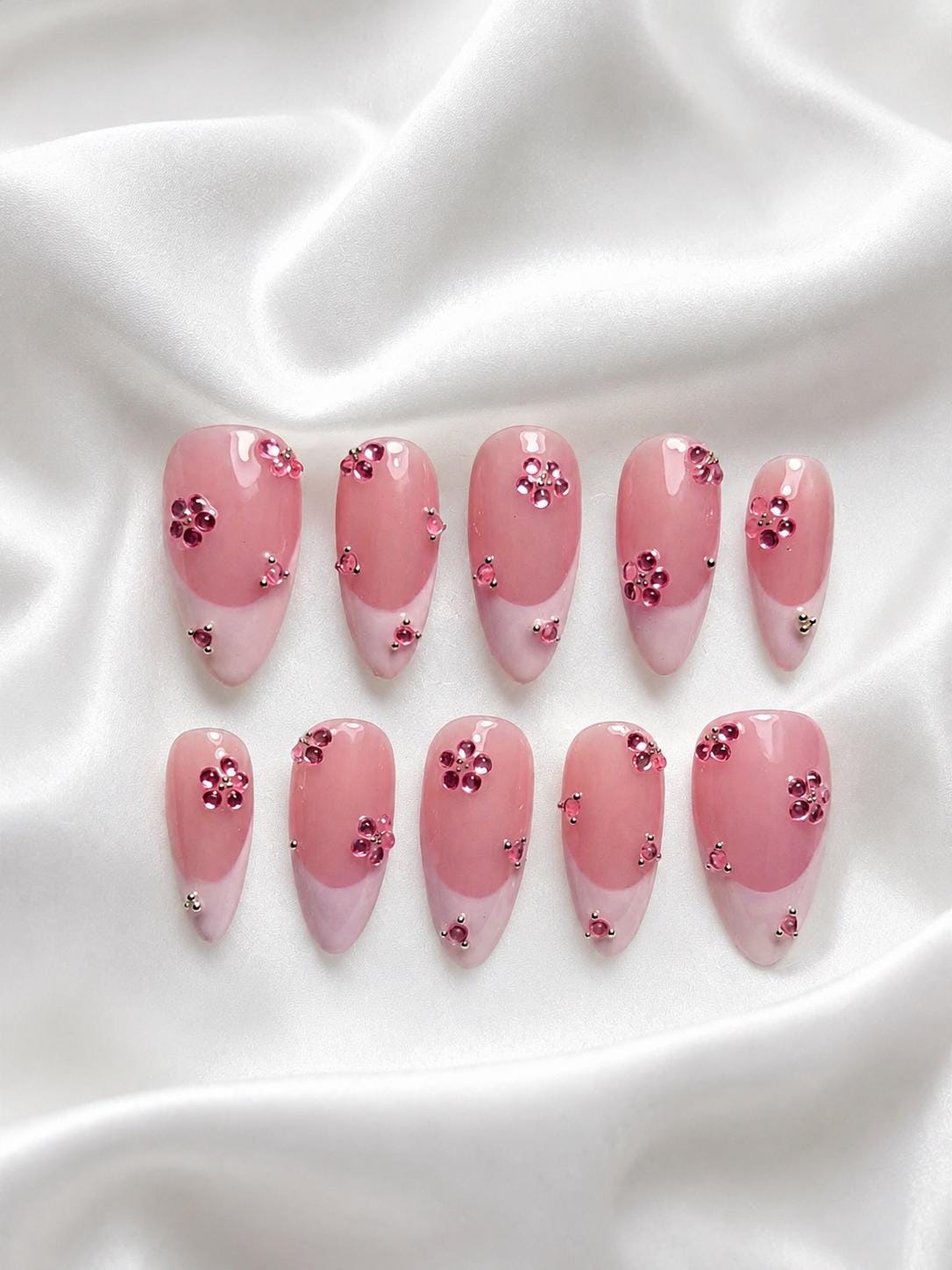 Sheer Rosy Pink Nails with Flower-Like Rhinestone Clusters