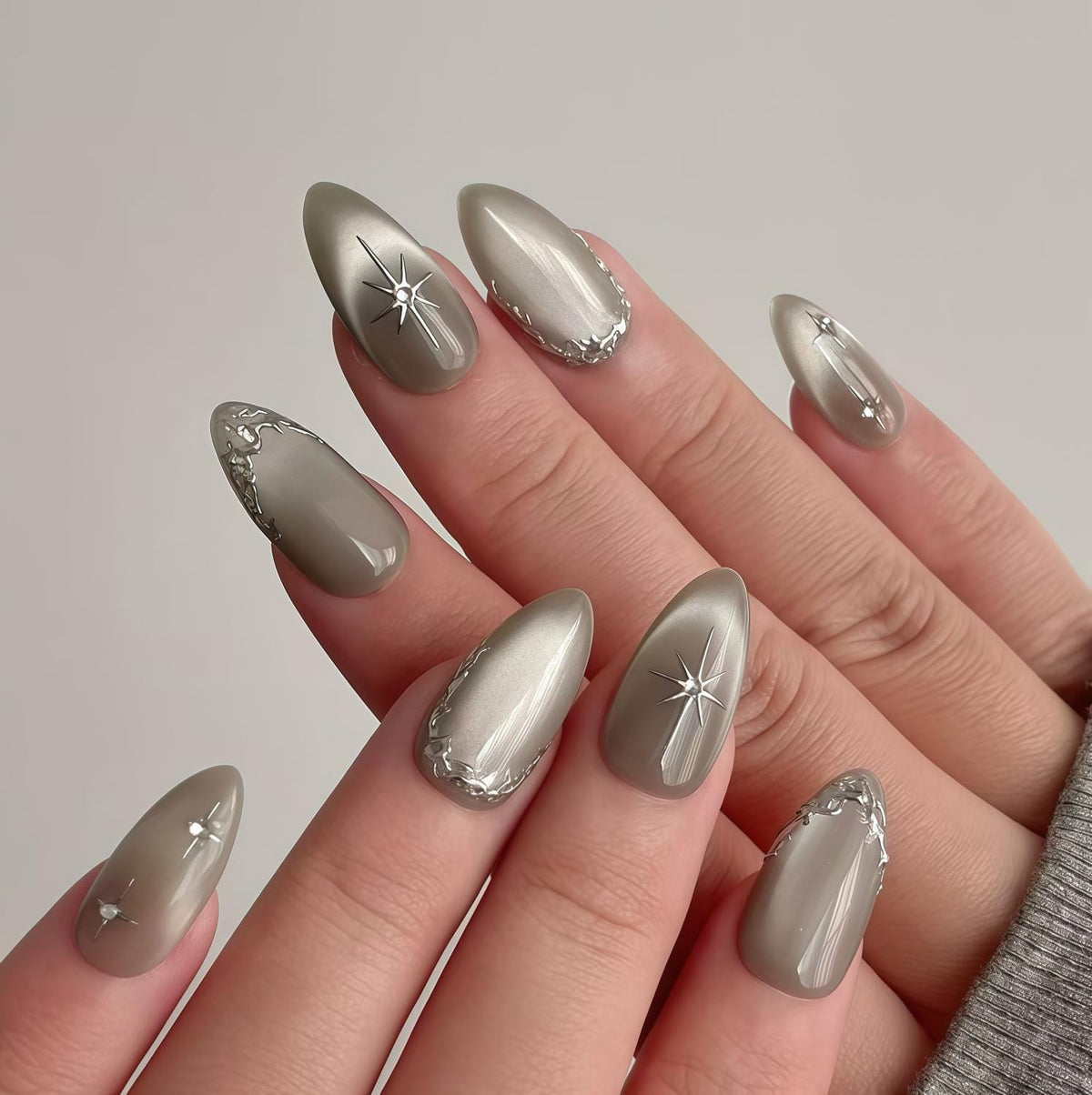 Silver Gray Cat Eye Nails With Starbursts and Raised Metallic Trim