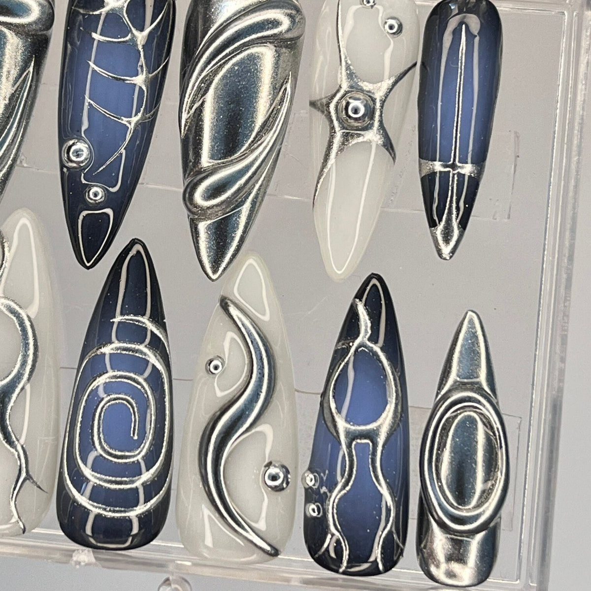 Silver, Navy, and Ivory Y2K Chrome Swirl Nail Set With Metallic Accents