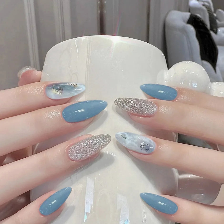 Sky Blue and Silver Glitter Nails With Cloudy Marble Accents