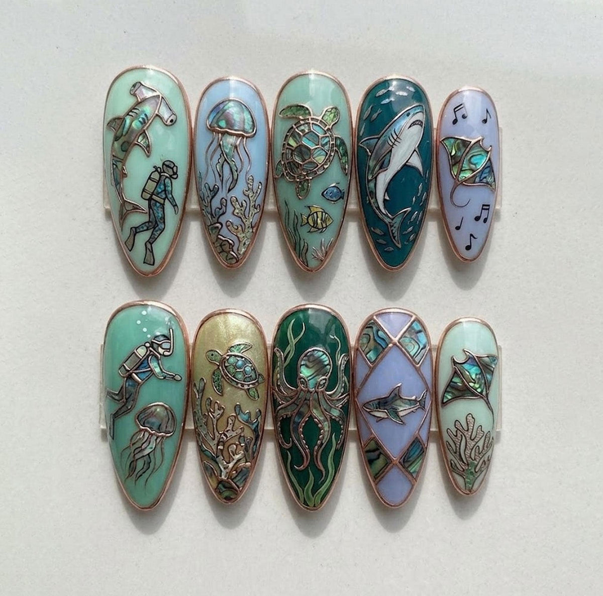Stained-Glass Ocean Nails With Marine Life and Rose-Gold Outlines