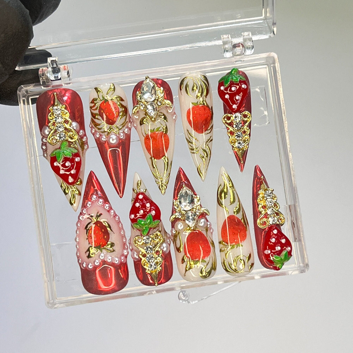 Strawberry Press-On Nail Set With Gold Embellishments and Rhinestones