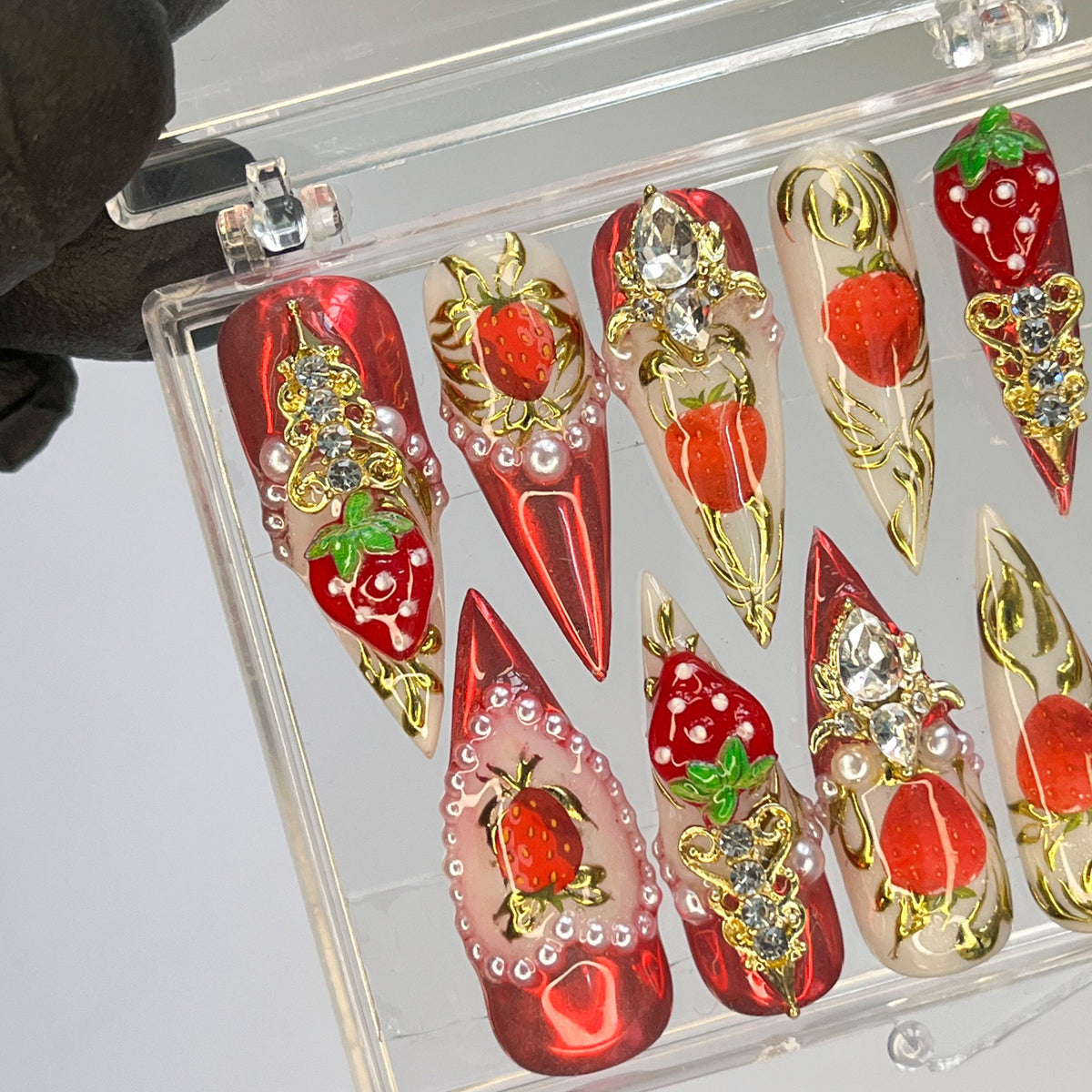 Strawberry Press-On Nail Set With Gold Embellishments and Rhinestones