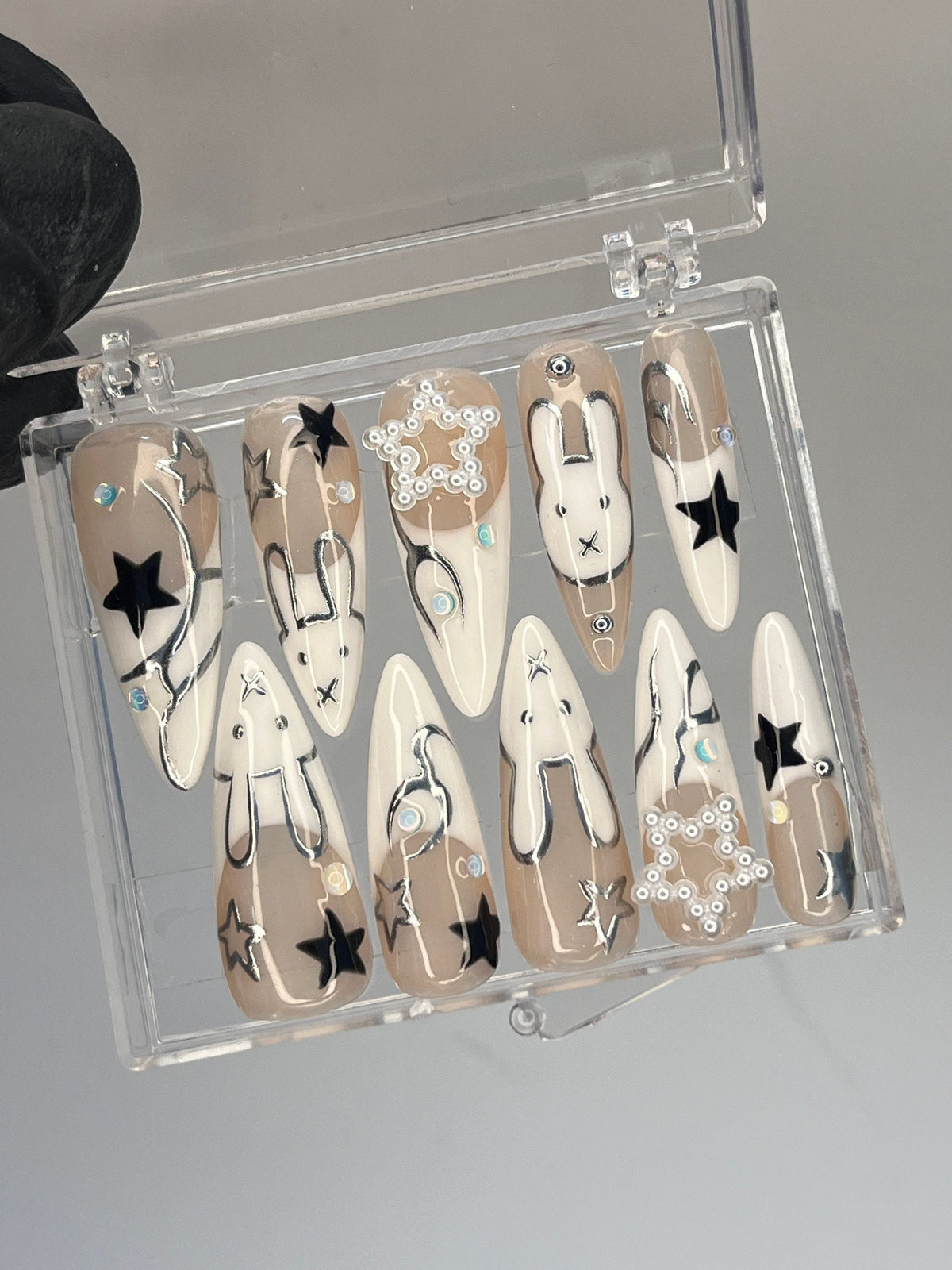 Taupe and White Star & Rabbit Nails With Pearl Clusters