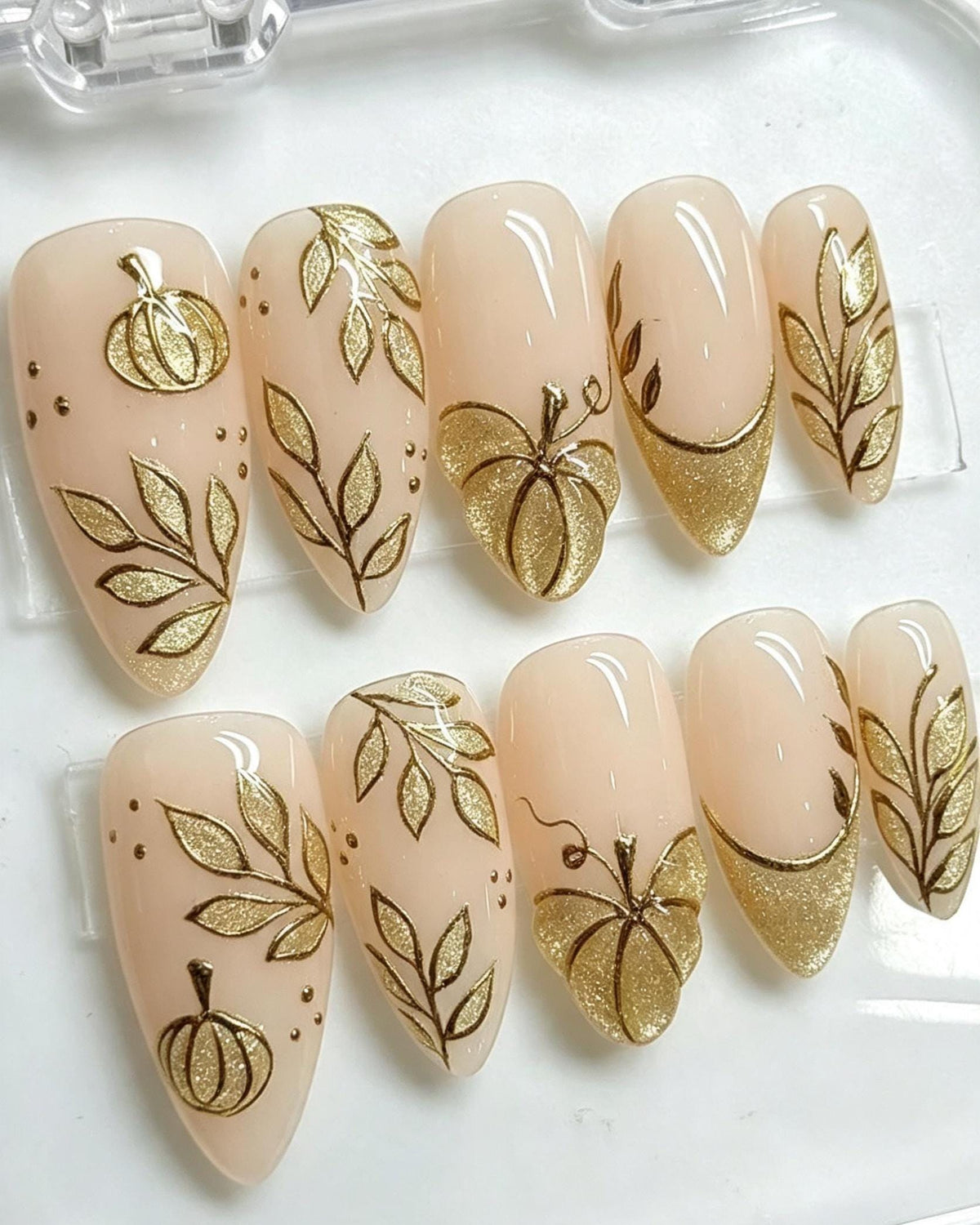 Thanksgiving Autumn Pumpkin Nails with Gold Glitter French Tips and Leaf Details