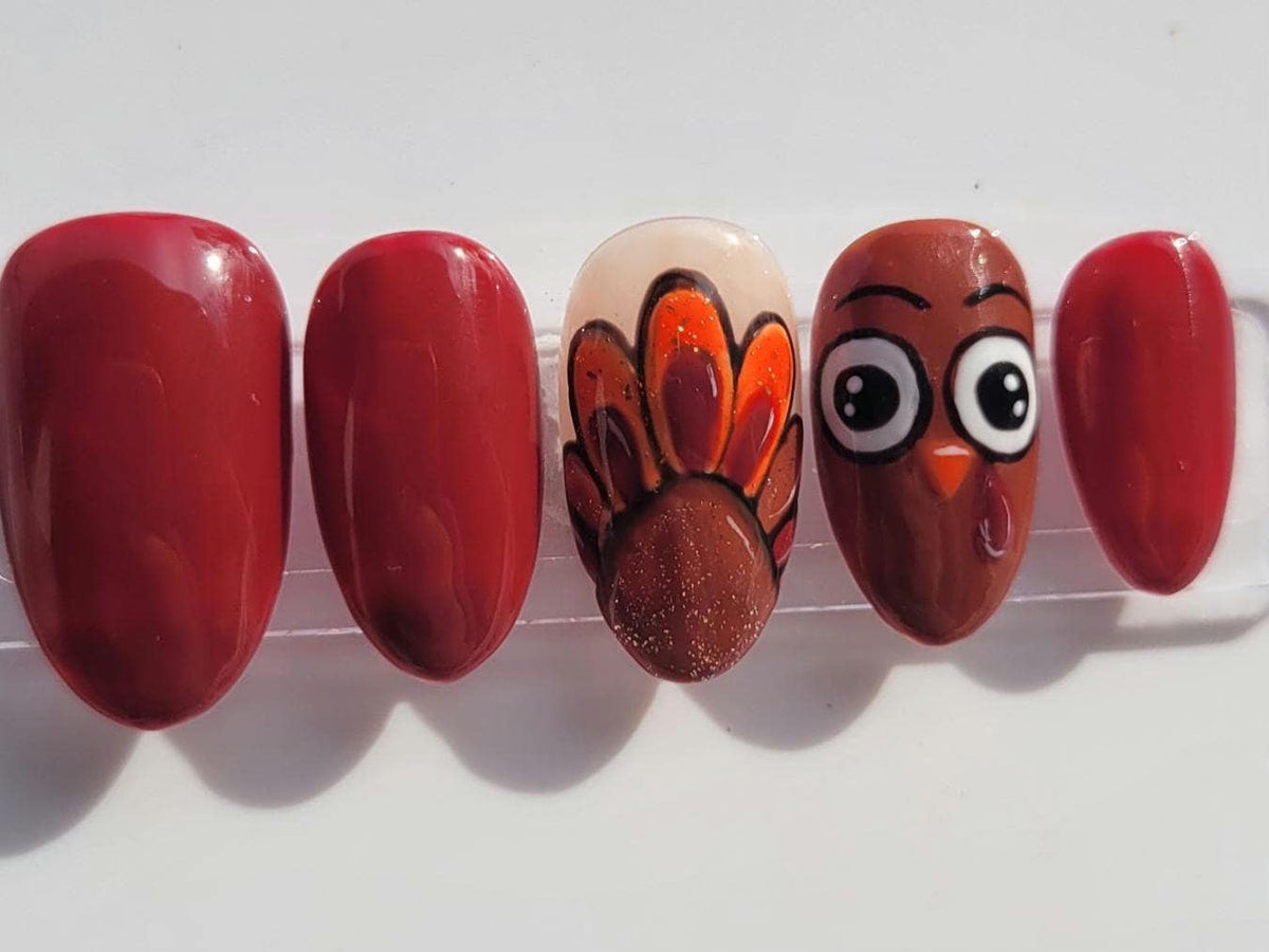 Thanksgiving Turkey Nails in Glossy Maroon with Painted Feather and Face Accents