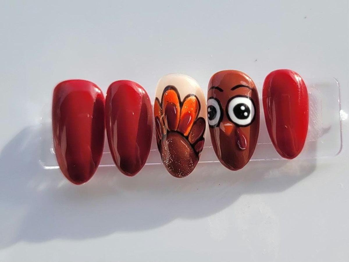 Thanksgiving Turkey Nails in Glossy Maroon with Painted Feather and Face Accents